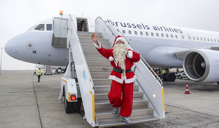 Santa Claus greets the tourists with Christmas gifts at Marsa Alam Airport  Photo
